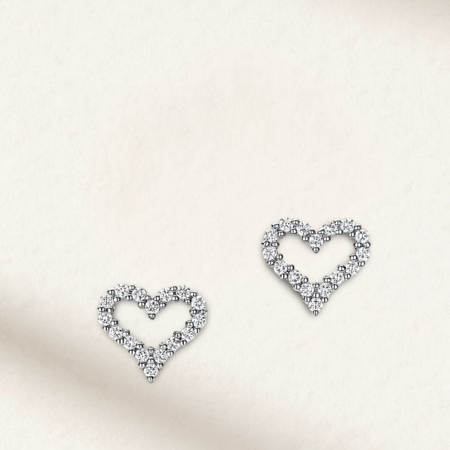 Heart-shaped moissanite bridal earrings in 925 sterling silver, featuring a sparkling and romantic design by Margalit Rings