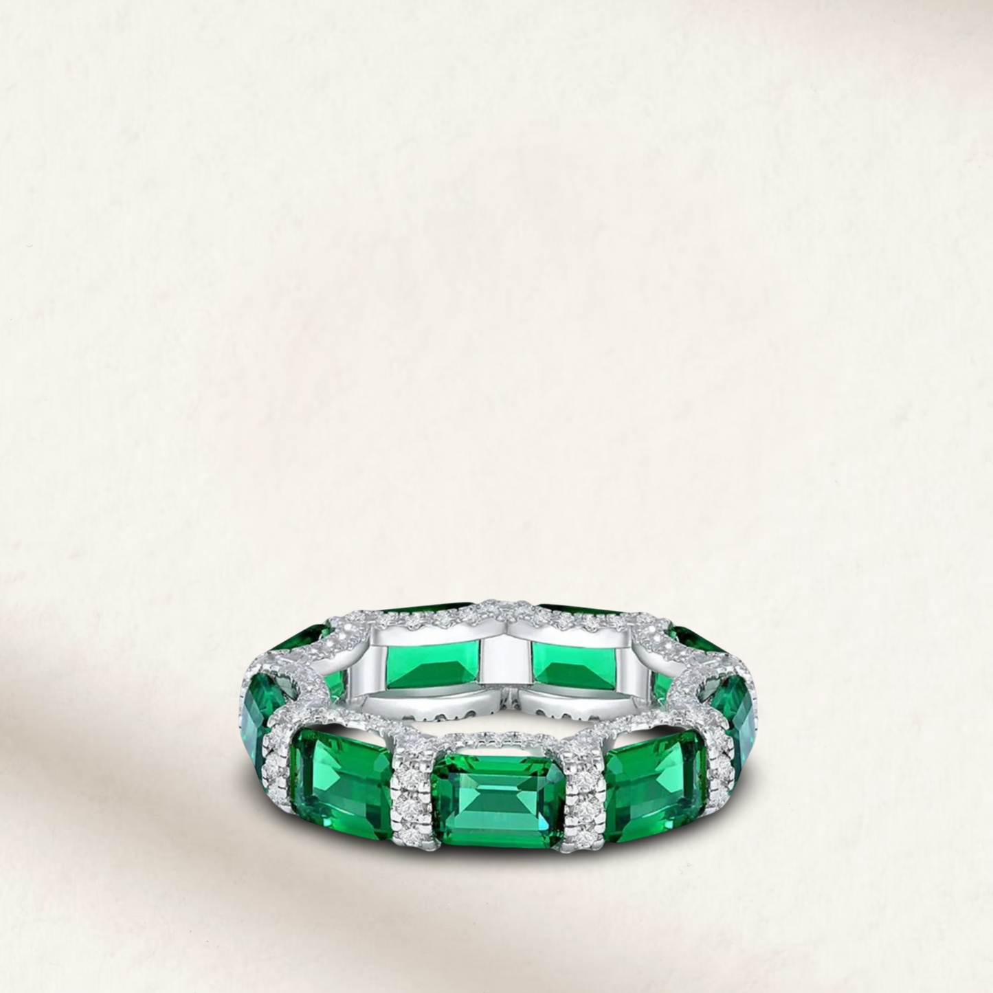 Stackable colored diamond eternity bands with emerald cut and micro pave stones, available in five vibrant colors, u-prong setting, perfect for layering Green