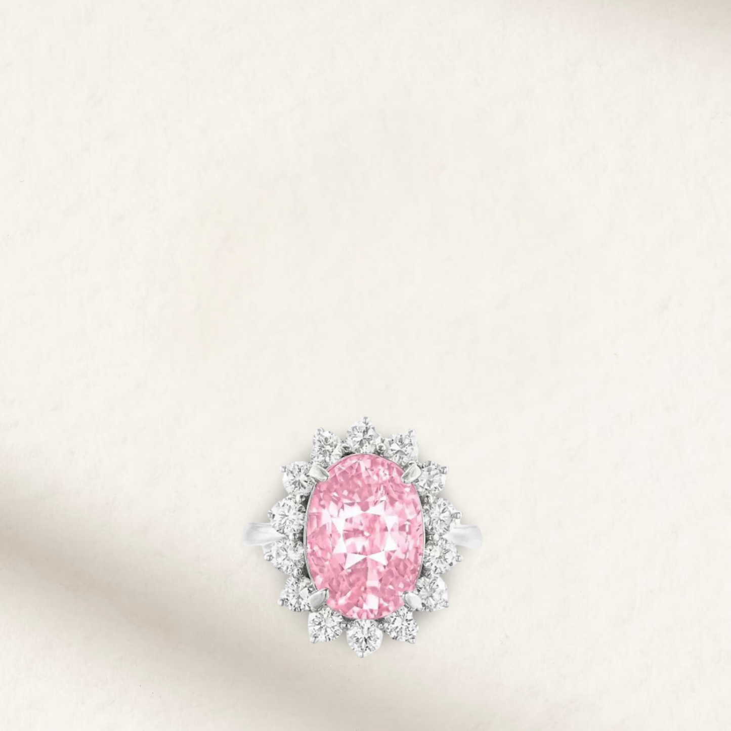 Lady Gaga inspired 9 Carat pink oval sapphire engagement ring with round brilliant accents and sterling silver band