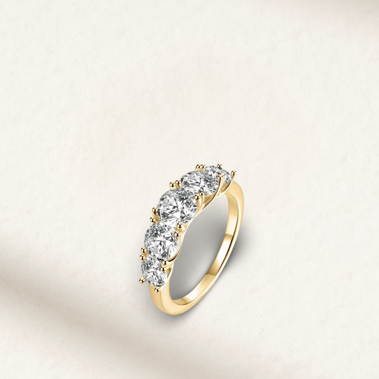 Yellow gold 5 stone eternity ring with 3.6 carats of round brilliant diamond simulants on a polished band.