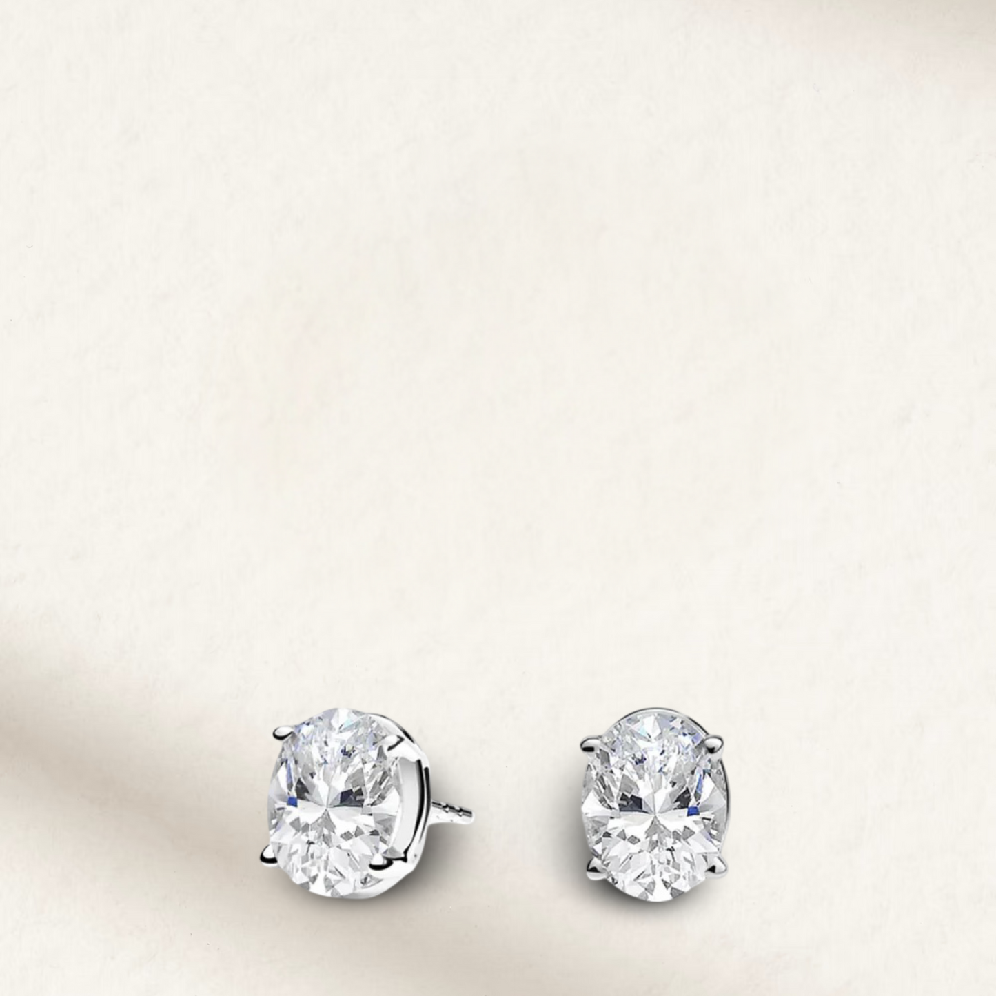 2.5 carat oval cut bridal stud earrings set in sterling silver, perfect for wedding day elegance