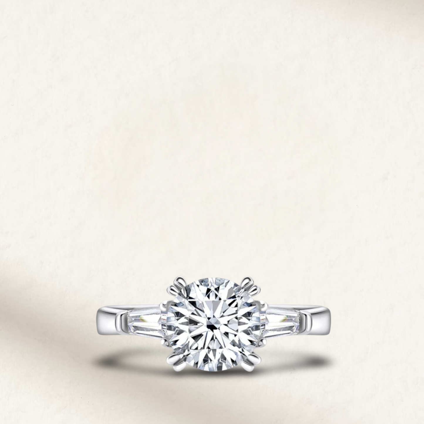 2 carat lab-made round cut three-stone engagement ring, featuring a classic design with a sterling silver setting.
