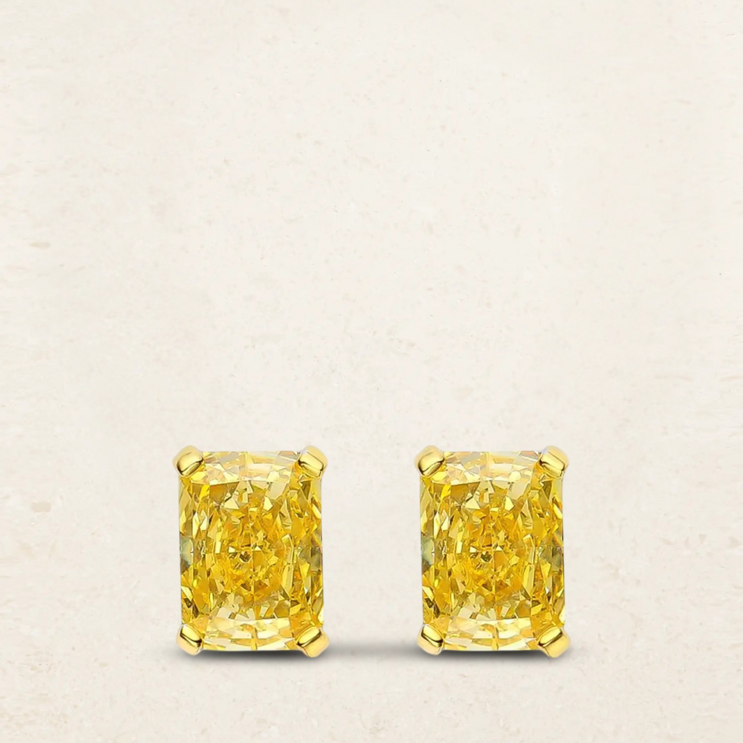 1 carat radiant cut fancy yellow stud earrings set in sterling silver, featuring vibrant color and classic elegance – perfect for adding a touch of luxury to any look.