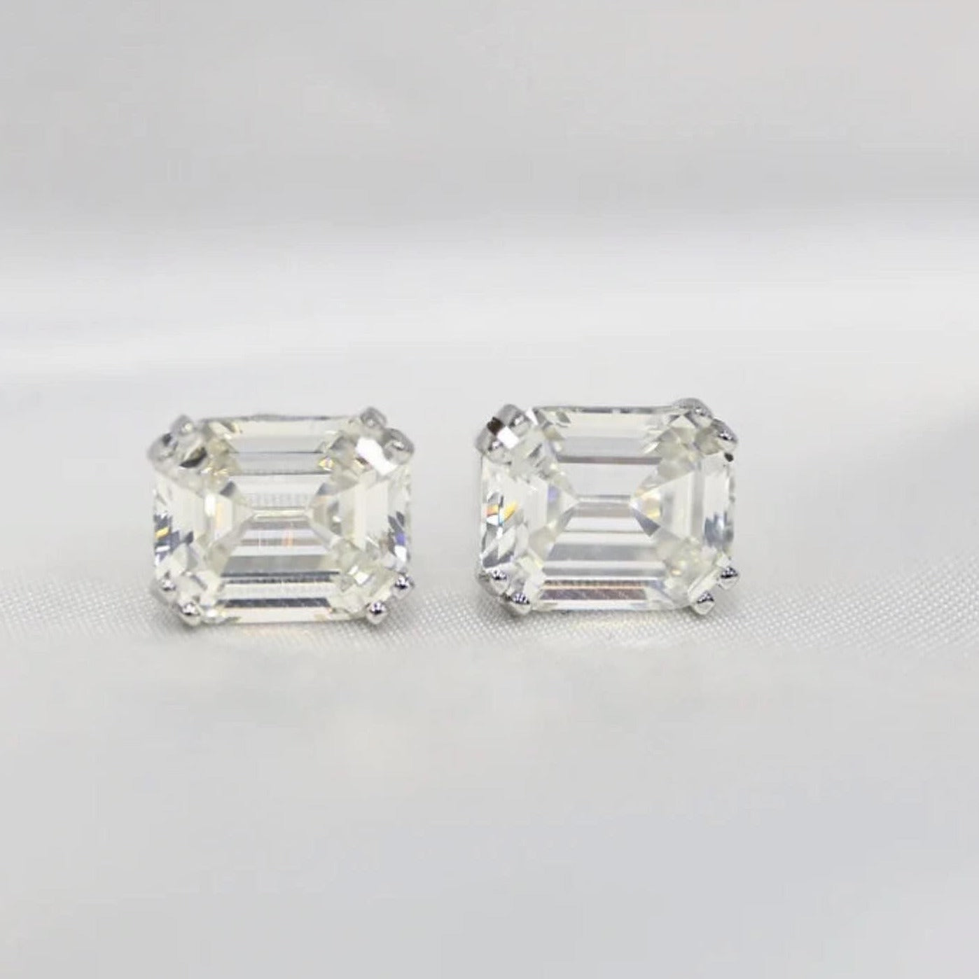 Our timeless, Emerald cut, sterling silver studs weighing 3 carats each, 8mm x 10mm stones. Our beautiful earrings are an elegant option for bridal jewellery or a special anniversary gift! Boxed and ready to go, these diamond earrings enhance any outfit front view by Margalit Rings