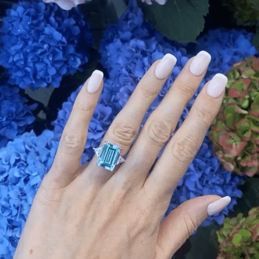 Princess Diana Aquamarine Ring Replica on a hand, 8.48 Carat, Emerald Cut - MargalitRings