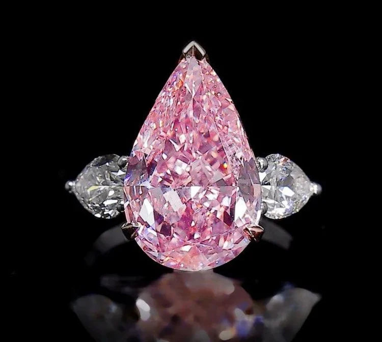 Shop pink rings with lab made stones in oval, emerald, cushion & more. From cocktail to engagement styles, find affordable, feminine sparkle at Margalit Rings.