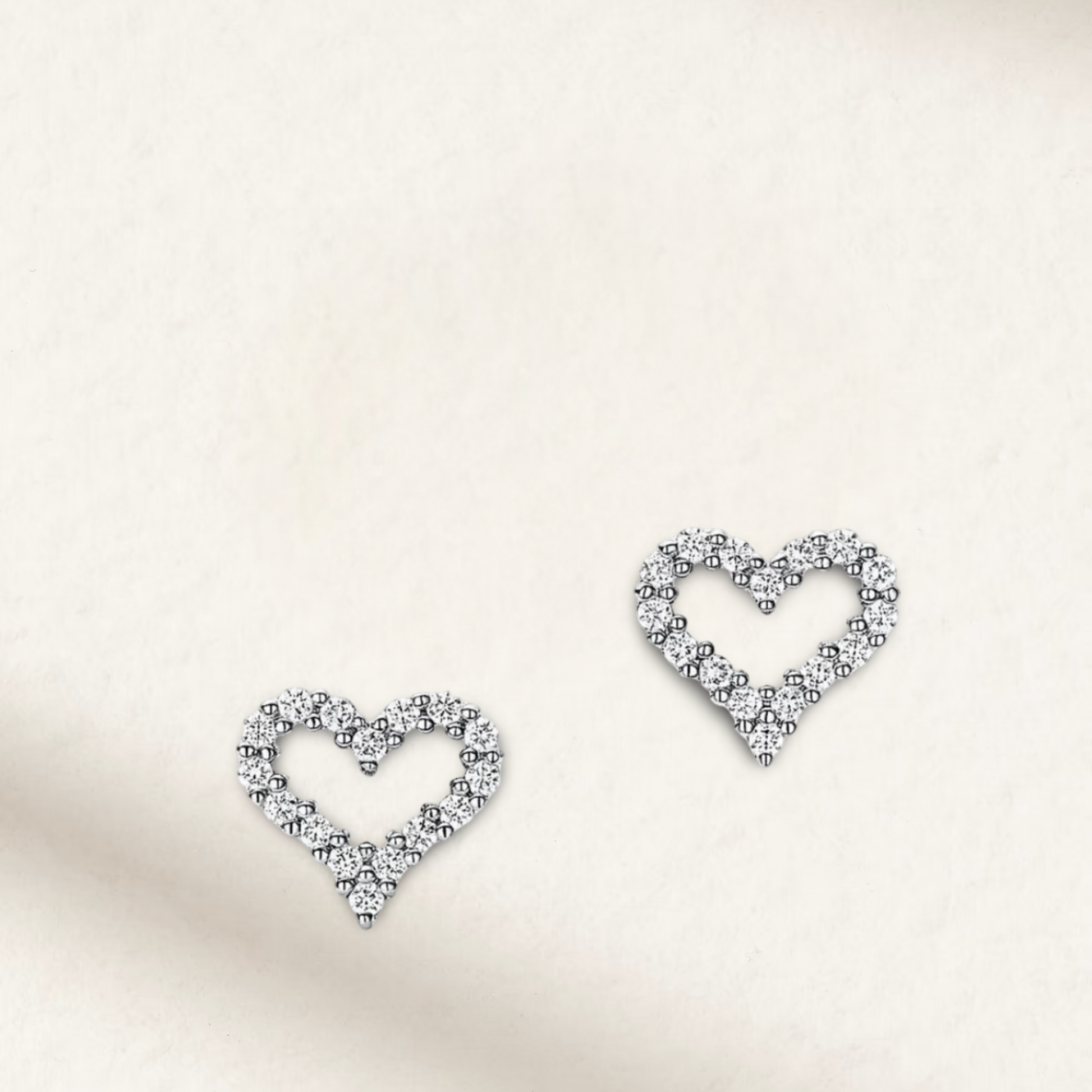 Heart-shaped moissanite bridal earrings in 925 sterling silver, featuring a sparkling and romantic design by Margalit Rings