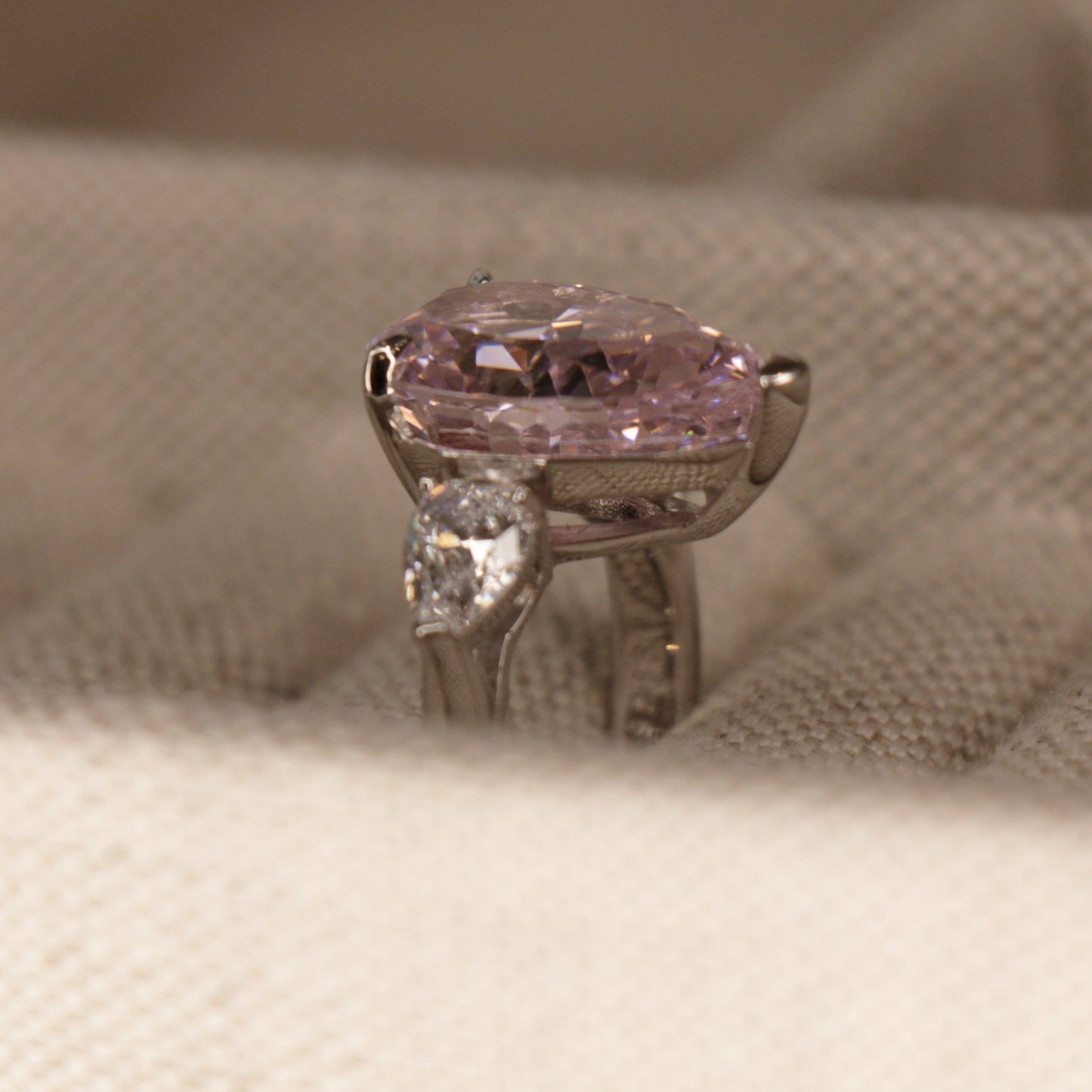 8 Carat Pink Pear Shape Engagement Ring on 925 Silver Band by Margalit Rings side view