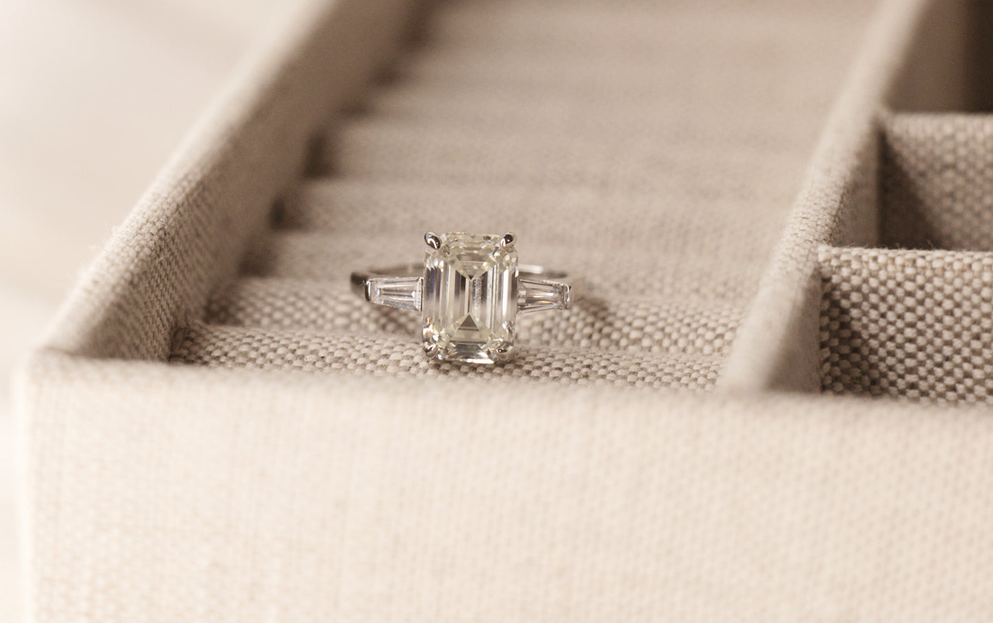 5 Carat Emerald Cut Engagement Ring with tapered baguettes on a 925 Sterling Silver band makes the perfect promise ring or proposal ring for her by margalit rings travel ring front