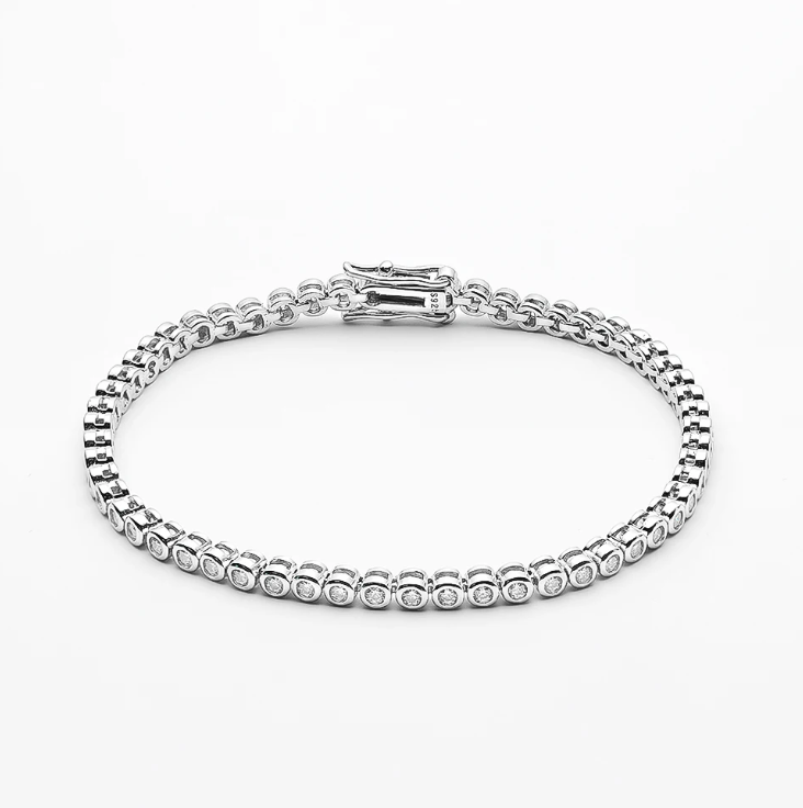 Our Bezel Set Silver Tennis Bracelet in 2mm stones is an elegant bridal, wedding day jewelry piece. This minimalist tennis bracelet can be worn alone or as a stackable bracelet to add to your existing bracelet stack.