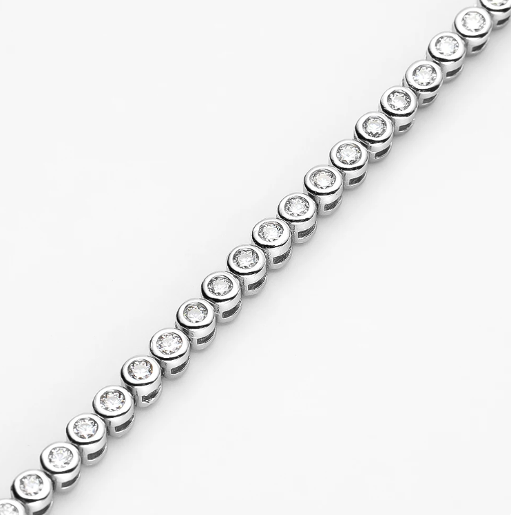 Our Bezel Set Silver Tennis Bracelet in 2mm stones is an elegant bridal, wedding day jewelry piece. This minimalist tennis bracelet can be worn alone or as a stackable bracelet to add to your existing bracelet stack zoomed