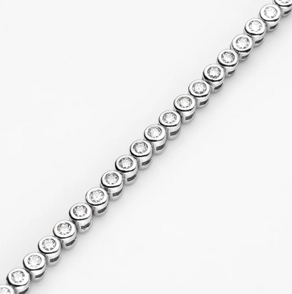 Our Bezel Set Silver Tennis Bracelet in 2mm stones is an elegant bridal, wedding day jewelry piece. This minimalist tennis bracelet can be worn alone or as a stackable bracelet to add to your existing bracelet stack zoomed