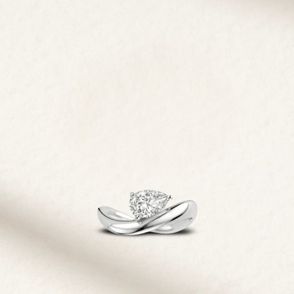 2 carat pear-shaped diamond simulant engagement ring in sterling silver with micro-pavé band by Margalit Rings.
