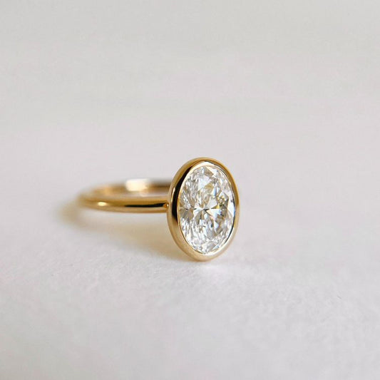 Yellow gold bezel set engagement ring