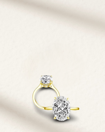 Hailey Bieber-inspired 6 Carat oval cut engagement ring with brilliant white lab-created gemstone, prong set in yellow gold
