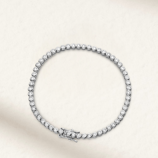 Minimalist silver tennis bracelet with 2mm round white brilliant stones in bezel setting, perfect for bridal, black tie, or everyday wear

