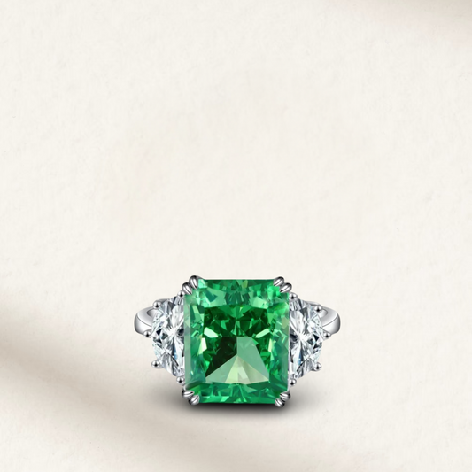 9 Carat emerald green radiant cut cocktail ring with silver prong setting, mounted on a sterling silver band, bold statement ring

