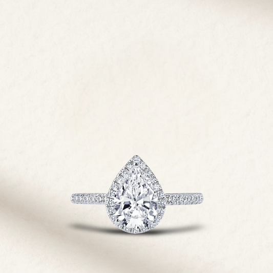 2 Carat pear shape white brilliant engagement ring with micro pave halo set on a sterling silver band, perfect for proposals and promise rings