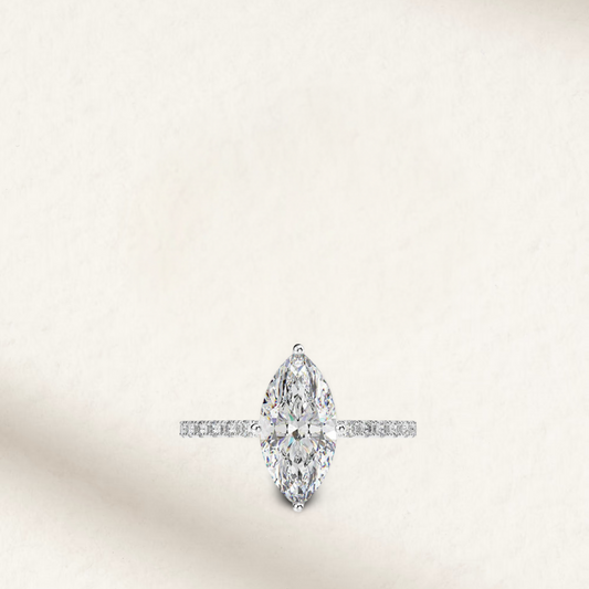 2 Carat marquise cut engagement ring with brilliant white lab-created gemstone on a sterling silver pavé band, perfect for bridal or promise ring.