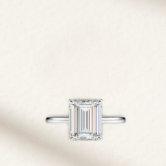 Emerald cut white brilliant engagement ring inspired by Amal Clooney, solitaire setting, sterling silver band