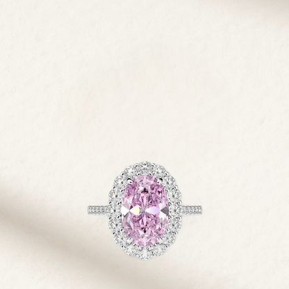 Light pink sapphire engagement ring in an oval cut with halo setting, inspired by Lady Gaga’s iconic engagement ring, set in 925 sterling silver – feminine and elegant design.

