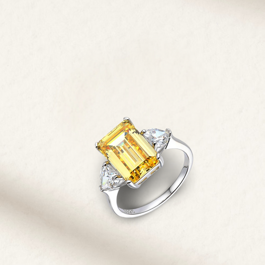 3-carat fancy yellow emerald-cut engagement ring in 925 sterling silver, showcased on a soft background—vibrant, elegant, engagement-ready.