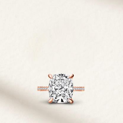 6 Carat Cushion Cut Engagement Ring with Hidden Halo in Gold by Margalit Rings – Diamond simulant, bold cushion shape, set in yellow gold with delicate hidden halo detailing, perfect for statement bridal jewelry.