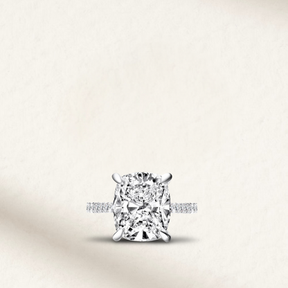 6 Carat Cushion Cut Engagement Ring with Hidden Halo in White Gold & Silver by Margalit Rings – Diamond simulant, bold cushion shape, set in yellow gold with delicate hidden halo detailing, perfect for statement bridal jewelry.