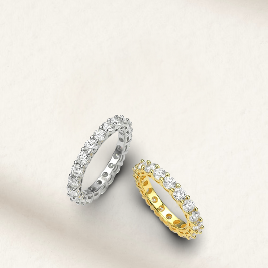 Yellow gold plated sterling silver eternity ring with continuous round diamond simulants in prong settings—classic and elegant.