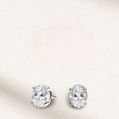 2.5 carat oval cut bridal stud earrings set in sterling silver, perfect for wedding day elegance