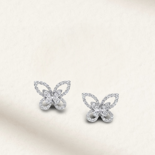 White brilliant butterfly-shaped stud earrings with silver screw-back posts, perfect for bridal, wedding day, or everyday wear.