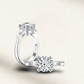 2 carat lab-made round cut three-stone engagement ring, featuring a classic design with a sterling silver setting.