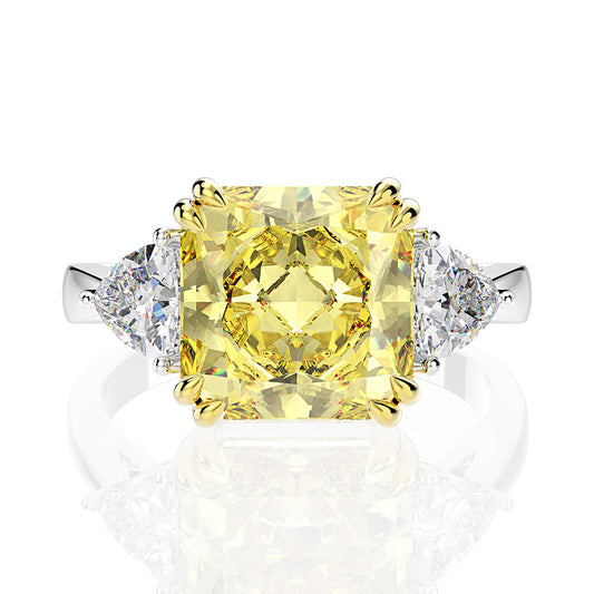 Our timeless 8 Carat Square Fancy Yellow Princess Cut Created Diamond Gemstone Engagement Ring flanked by two trillions on a 100% 925 Sterling Silver band Margalit Rings