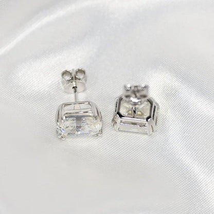 Our timeless, Emerald cut, sterling silver studs weighing 3 carats each, 8mm x 10mm stones. Our beautiful earrings are an elegant option for bridal jewellery or a special anniversary gift! Boxed and ready to go, these diamond earrings enhance any outfit close up by Margalit Rings