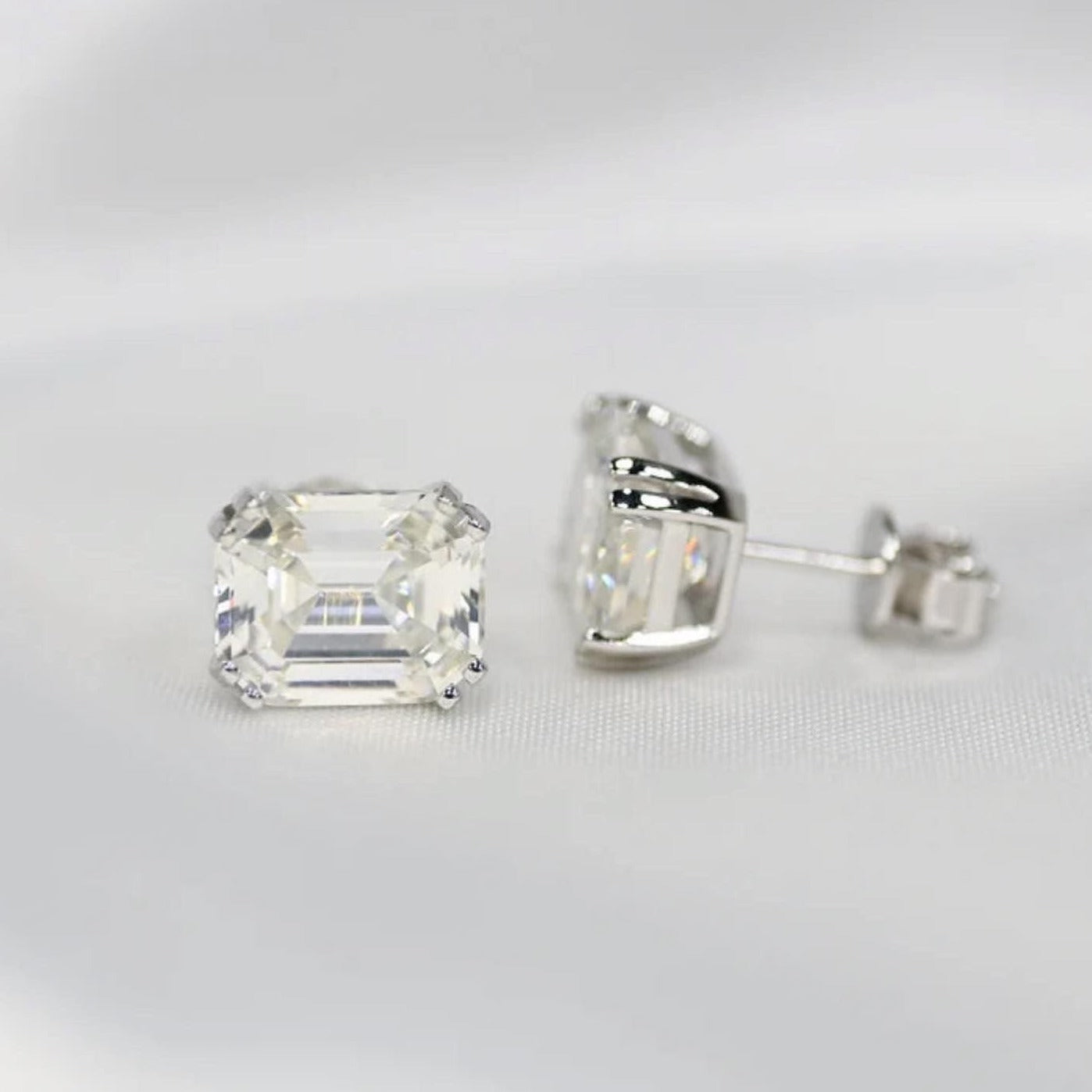 Our timeless, Emerald cut, sterling silver studs weighing 3 carats each, 8mm x 10mm stones. Our beautiful earrings are an elegant option for bridal jewellery or a special anniversary gift! Boxed and ready to go, these diamond earrings enhance any outfit by Margalit Rings